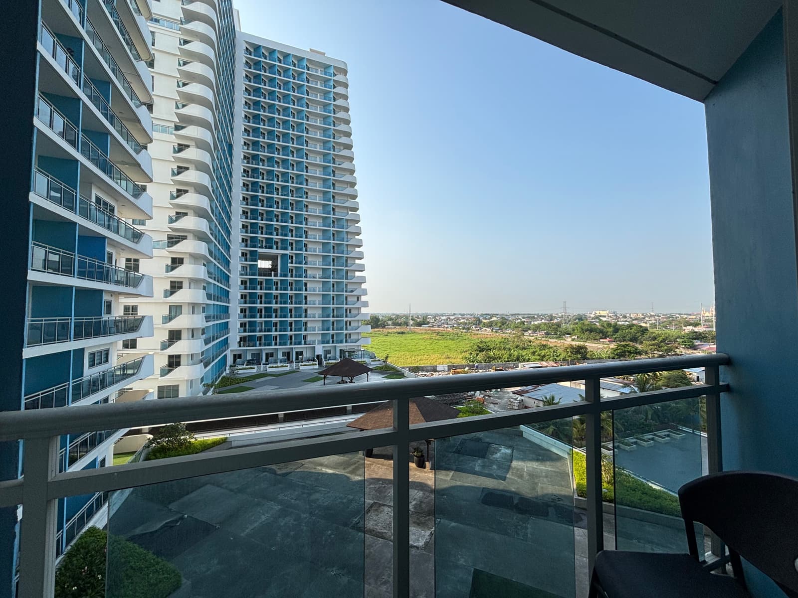 Balcony view of Azure North towers and resort-style wave pool