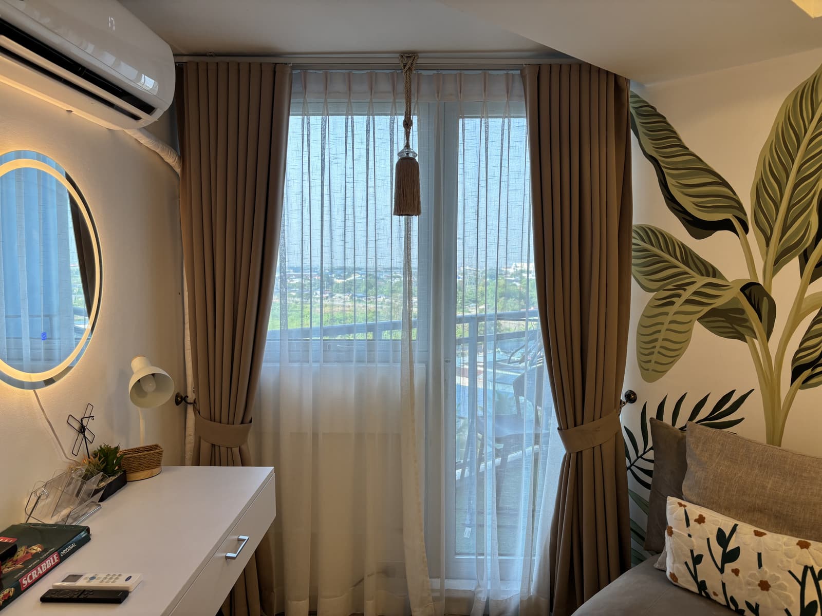 Floor-to-ceiling window with sweeping high-rise city view