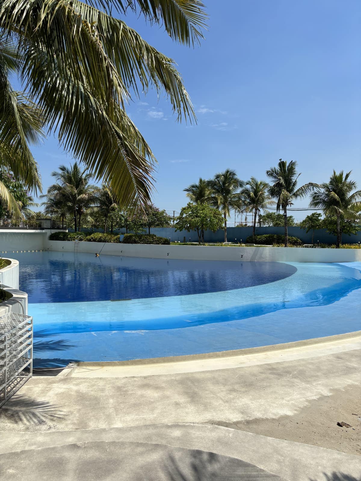 Wave pool and man-made beach with crystal-blue water